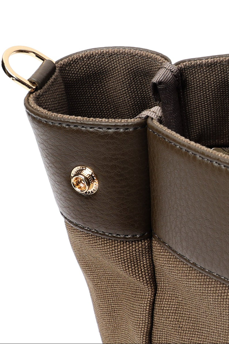 Detail of Brown two-tone small tote bag with contrasting trim and gold-tone hardware.