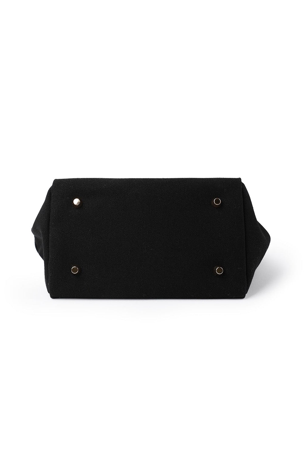 Bottom of the two-tone small tote bag showing its lining and storage compartment.