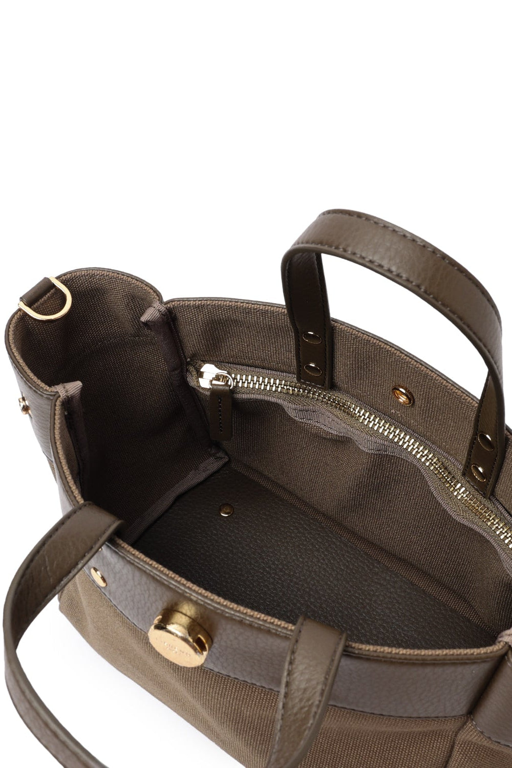Interior of the two-tone small tote bag showing its lining and storage compartment.