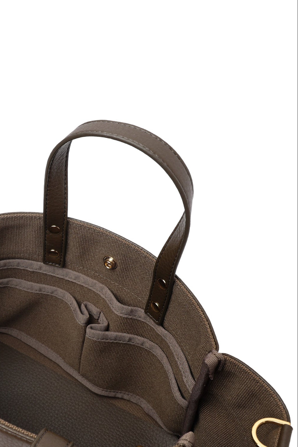 Interior of the two-tone small tote bag showing its lining and storage compartment.