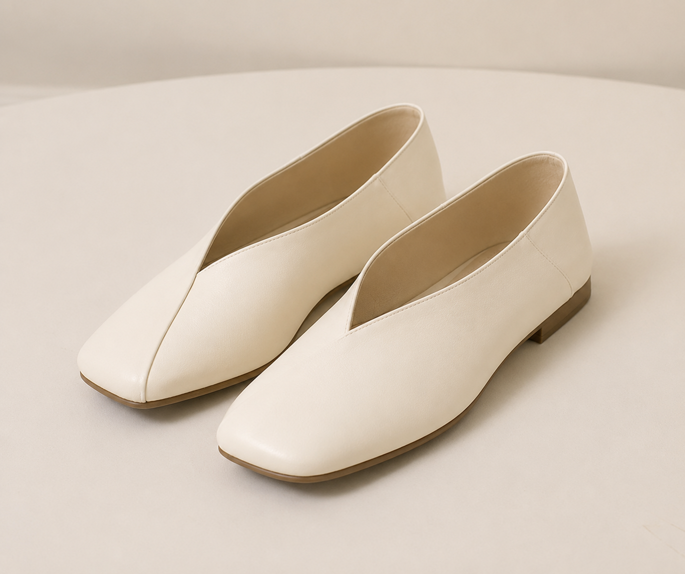 Ivory leather square-toe flat shoes with a deep V-cut opening and low heel